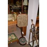 A 19th Century mahogany pole screen; together with a beadwork footstool.