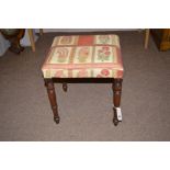 A 19th Century mahogany stool with modern upholstery.