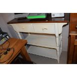 A cream painted and brown stained hardwood upright kitchen cabinet, fitted two drawers.