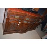 A Victorian carved and stained walnut sideboard base, fitted a combination of four drawers,