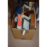 Art materials, to include: oil paints; watercolours; pencils; and paper, in a box.