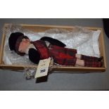 A German bisque head doll in Scottish attire marked 'Germany', probably Armand Marseille.