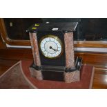 A late 19th Century mantel clock in slate and marble architectural style case,