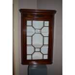 A 19th Century inlaid mahogany corner cabinet, 104cms high.