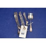 A George III and later sugar tongs and silver scoop spoon, 3.4oz.