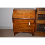 An Edwardian inlaid mahogany bureau with shell pateria, 76cms wide.