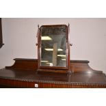 A 19th Century mahogany swing toilet mirror.