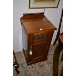 An early 20th Century pedestal bedside cupboard, 82cms high.