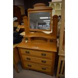 A satin walnut dressing chest of three drawers,