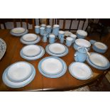 A Denby part tea and dinner set to include teapot, dinner plates, cups, jugs, bowls and other items.