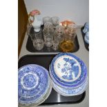 Glassware to include lidded jars and jugs together with blue and white willow pattern plates.