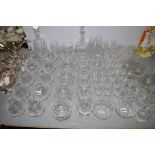 Crystal and cut glassware to include two decanters, twelve brandy glasses, champagne flutes,