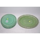 Five 19th Century green glazed plates; and an oval dish.