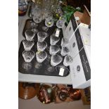 Twelve Waterford crystal Lismore wine glasses; and six hock glasses.