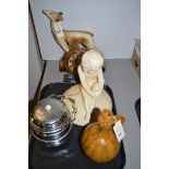 A French Art Deco pottery deer; a Bretby earthenware child; a Deco style mantel clock; an Adamesk;