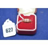 A ruby and diamond ring on 18ct. yellow gold shank, ring size P, 2.4grms gross.