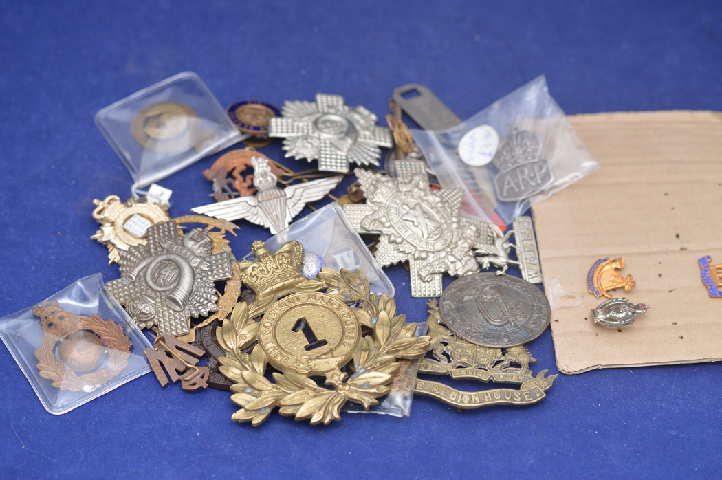 Cap badges to include ARP; on War Service 1915; Royal Army Ordinance Corps and others (a quantity).