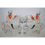 A pair of Staffordshire flat back equestrian figures depicting 'Garibaldi' and 'C. Peard'.