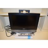 A Humax LCD TV, 17in., with remote control and manual.