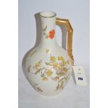 A Royal Worcester pencilled ivory ground ewer,