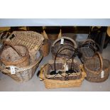 Approximately twelve wicker baskets of differing sizes; together with two modern table spot lamps.