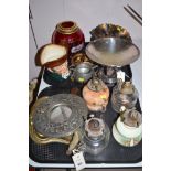 Glass and metalware to include four oil lamps, a brass crumb tray, a silver plate tazza,