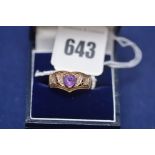 An amethyst and diamond dress ring on 9ct. yellow gold shank, ring size S, 3.2grms gross.