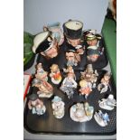 Figures to include hummel together with Royal Doulton character jugs of varying sizes including