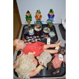 Three vintage dolls together with Morano glass clowns,