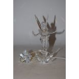 A Swarovski Tinkerbell and star crystal figurine.