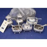 A George V silver condiment set by A & Co Ltd, Birmingham 1927 to include table salts,