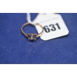 A diamond ring on yellow metal shank stamped 18ct, ring size O, 3.1grms gross.