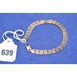 A 9ct. yellow gold gate link bracelet, 6.7grms.