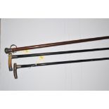 Horn handled and silver mounted walking sticks and another silver mounted and wooden walking stick.