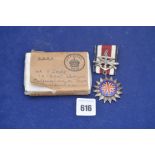 A white metal Long Service Award medal Corps of Commissioners awarded to J Scott, boxed.