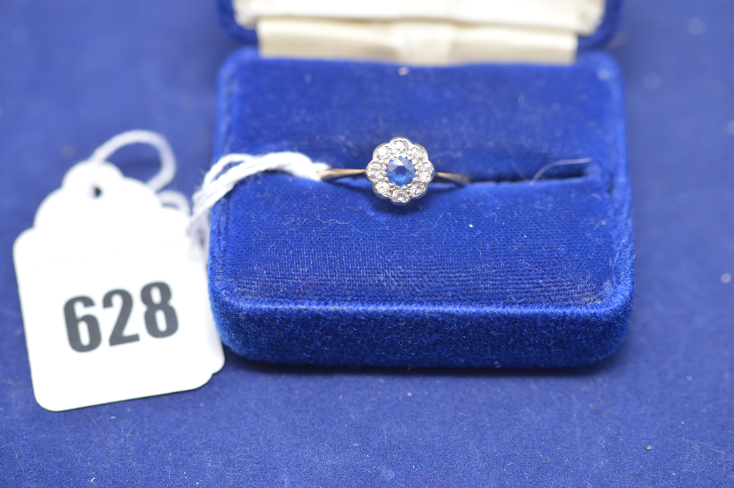 A sapphire and diamond flowerhead ring on yellow metal shank stamped 18ct, ring size Q, 2.