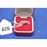 A five stone diamond ring on 18ct. yellow gold shank, ring size N, 2,3grms gross.