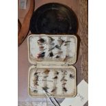 Hardy of Alnwick a neroda dry fly fishing box and a circular bakerlight cass box both with contents.