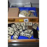 A set of bone and ebony dominoes; playing cards;