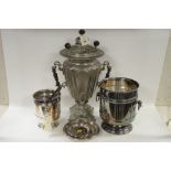 Samovar together with plated ice buckets and dishes