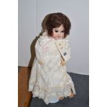 French porcelain headed doll.