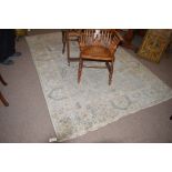 A hand knotted Indian Persian style rug, 266 x 183 cms.