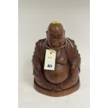 A carved wooden Buddha.