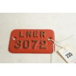 A red painted cast bronze railway plate for a...