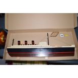 A 'Titanic' wooden carved decorative model of the Queen Mary steamer, limited edition no. 17.