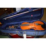 An Aubert violin in fitted case with bow.