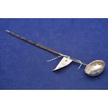 A white metal toddy ladle