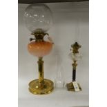 Two glass oil lamps