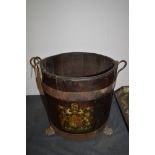 A stained oak log bucket with royal coat of arms