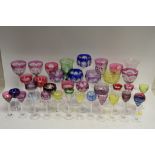 Coloured glassware of varying sizes